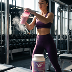 Athletic woman drinking Royal Protein whey protein shake in a lifestyle fitness setting