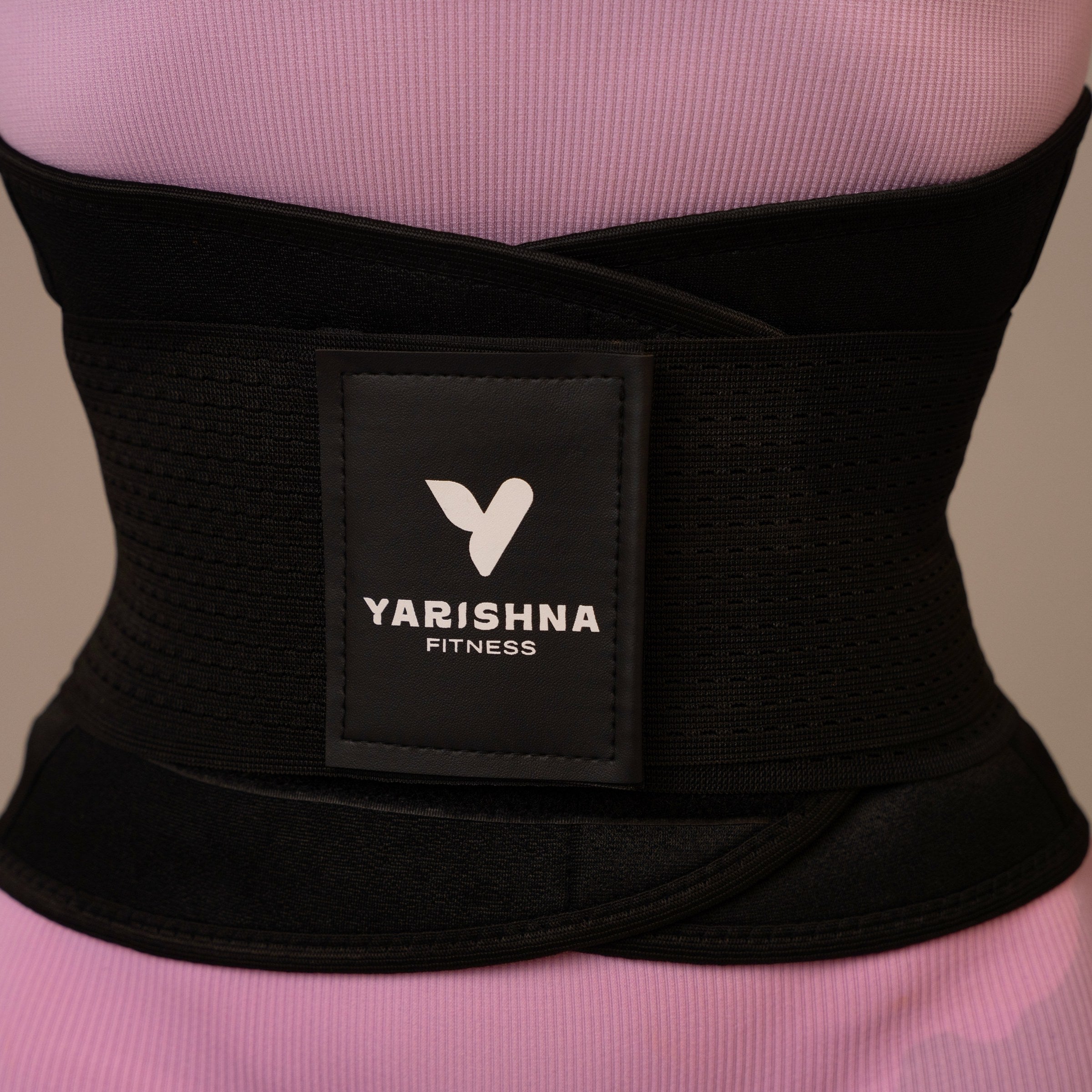 Close-up of the Yarishna Waist Trainer worn at the waist, front view with logo