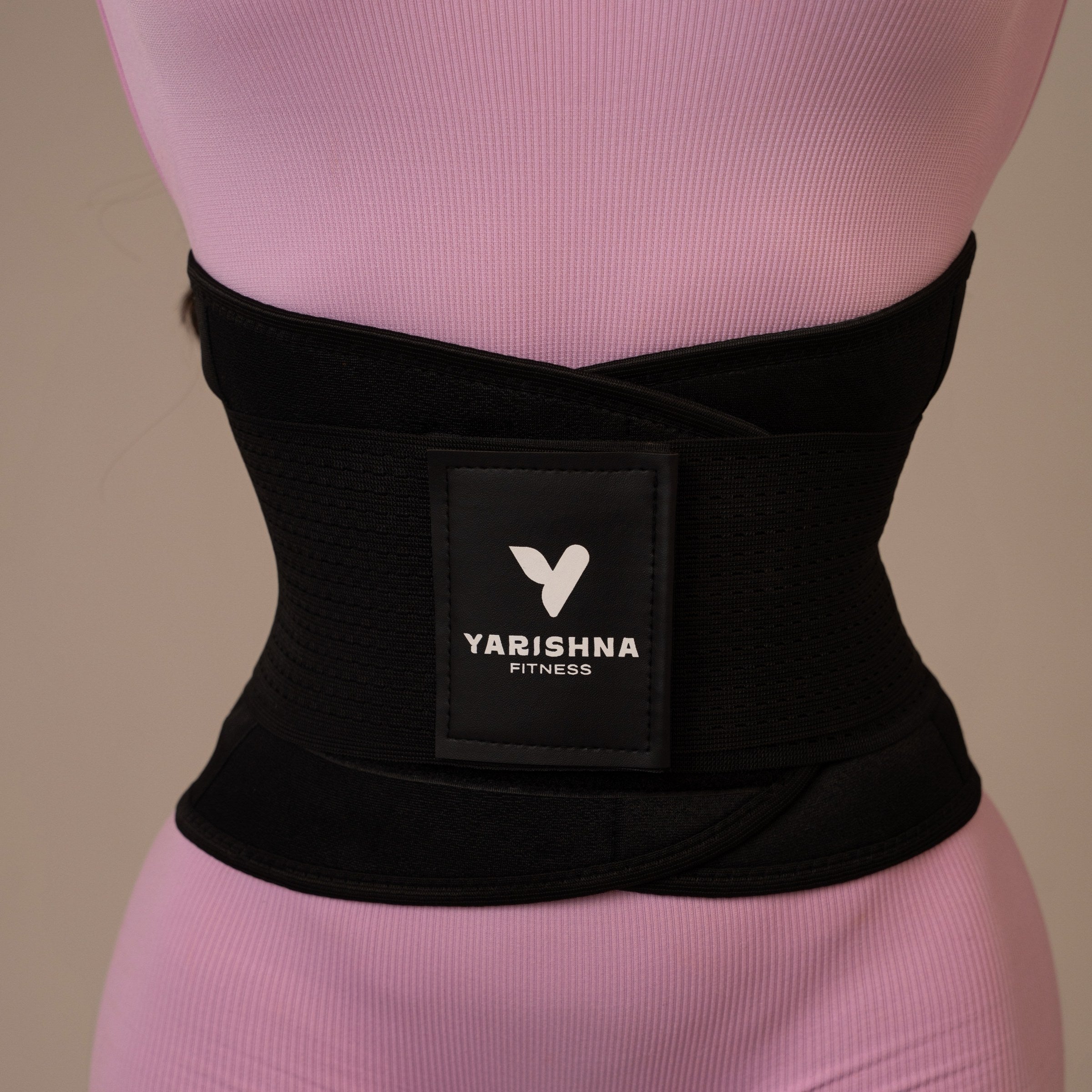 Yarishna Waist Trainer worn over a pink workout set, front view